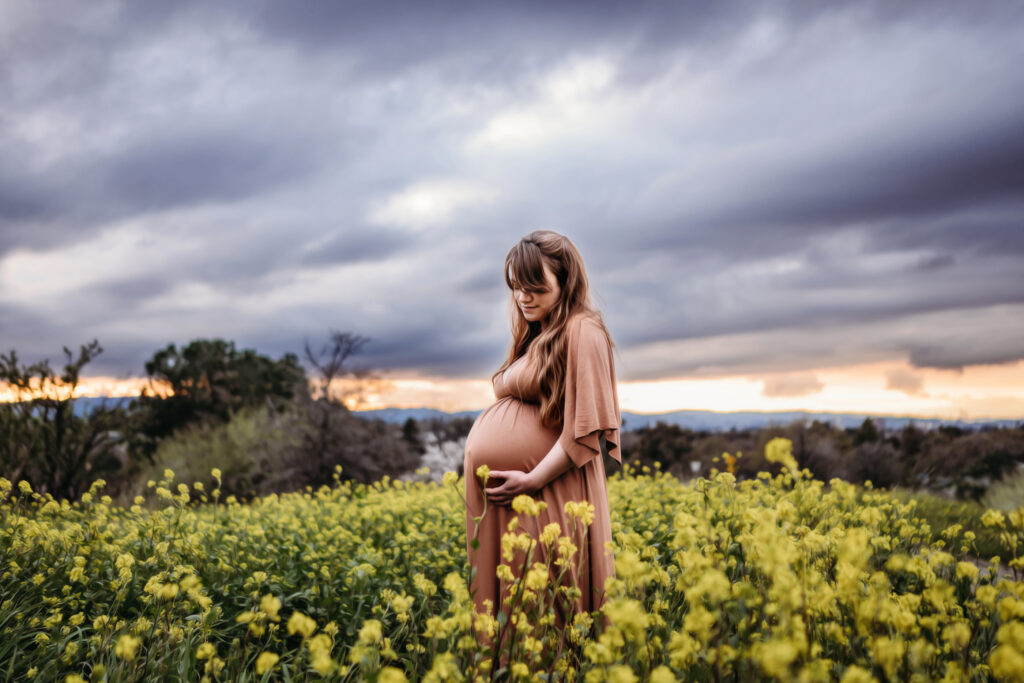 pregnant mom surrounded by walnut creek mustard flowers