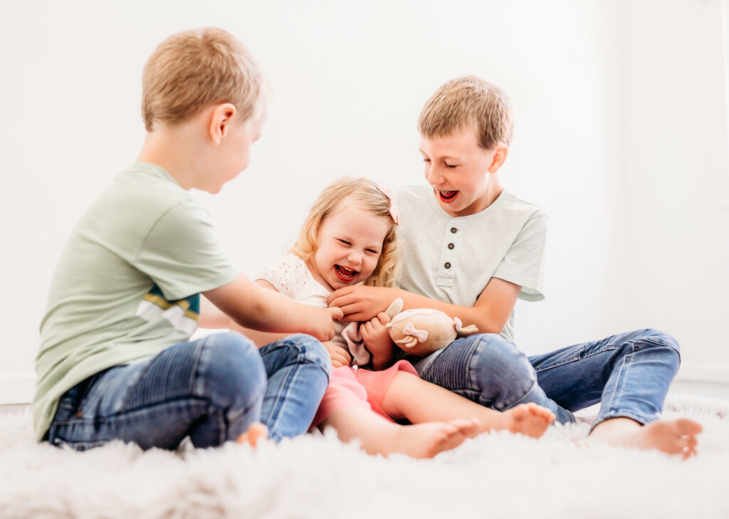 Fun photo of 3 siblings during their portrait session