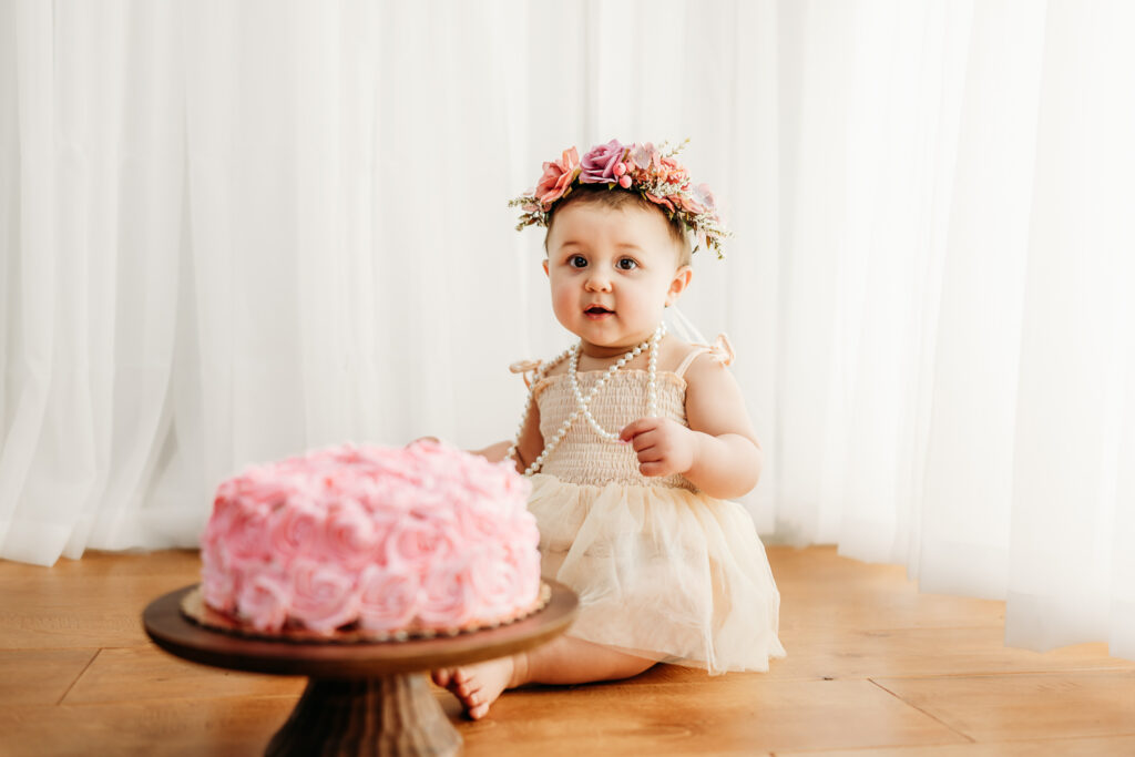 studio cake smash session for a 1 year old baby girl at her first birthday