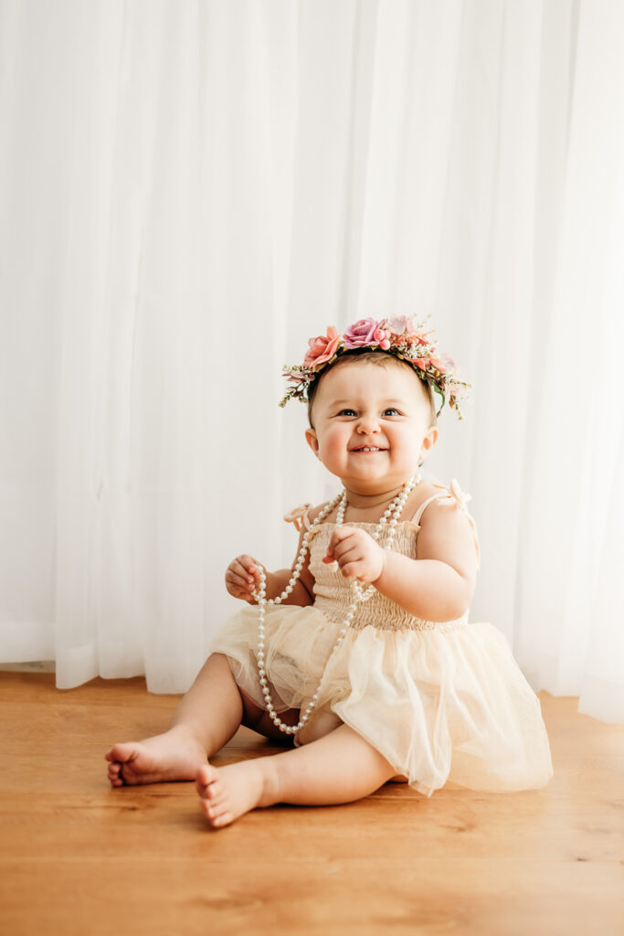1 year old in a photo studio for a first birthday photoshoot