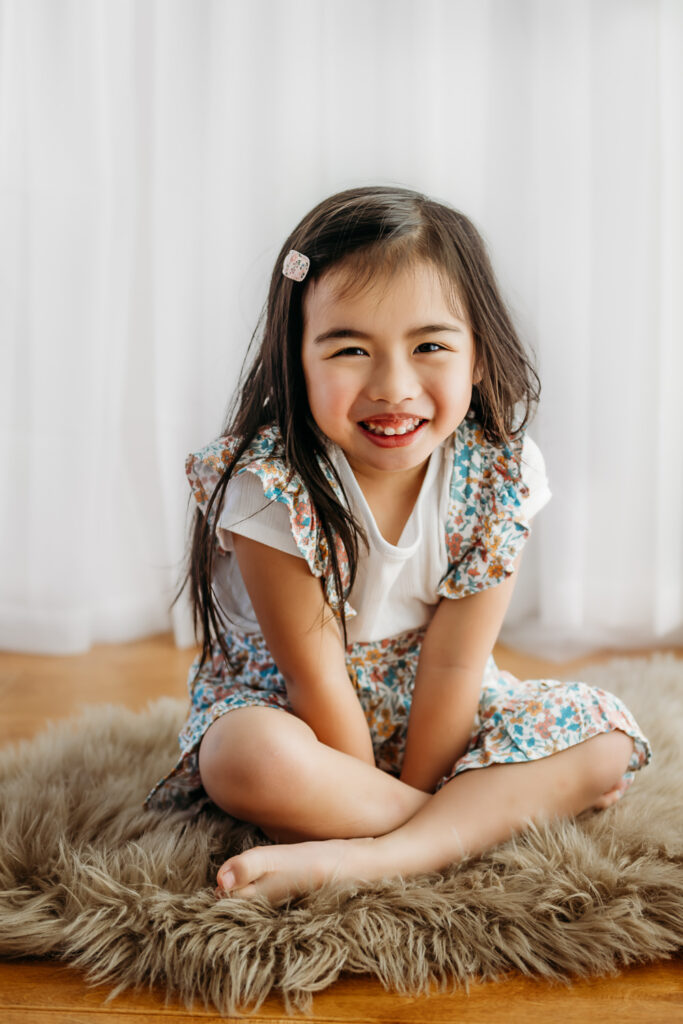 young girl smiling at camera for her photo shoot