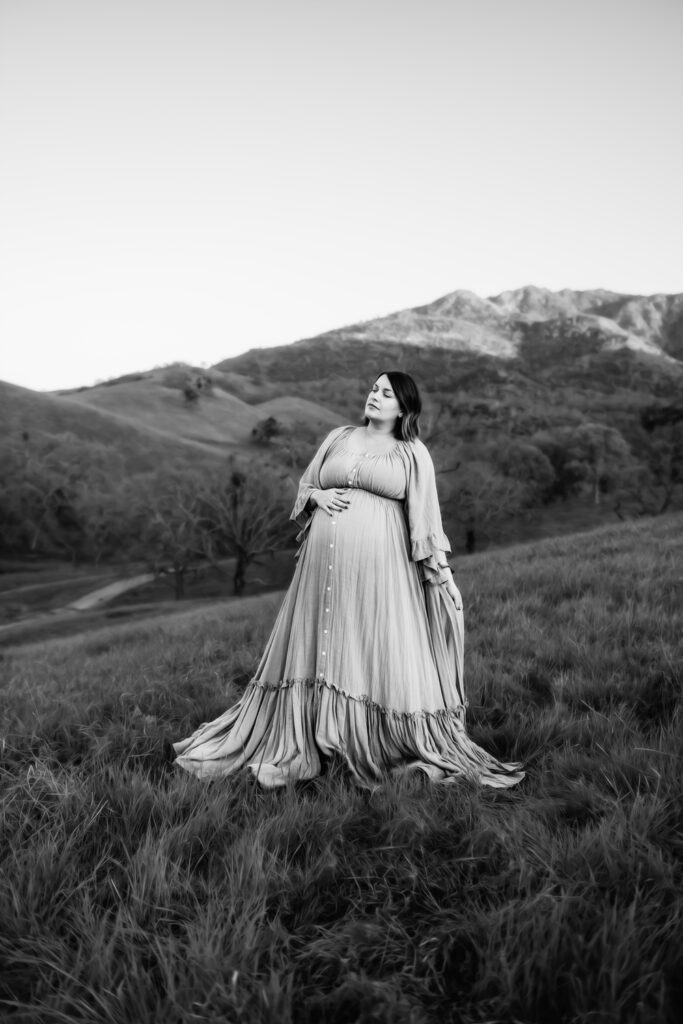 black and white image of a beautiful pregnant mama. her eyes are closed and she looks calm and peaceful.