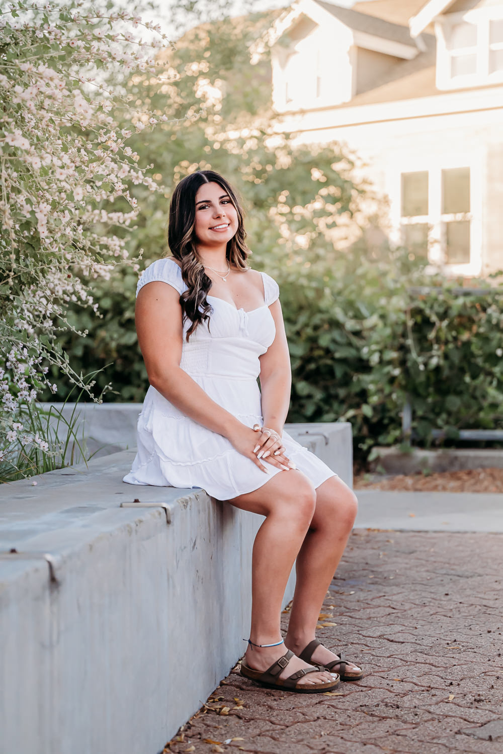 senior photo of girl in downtown martinez smiling at the camera