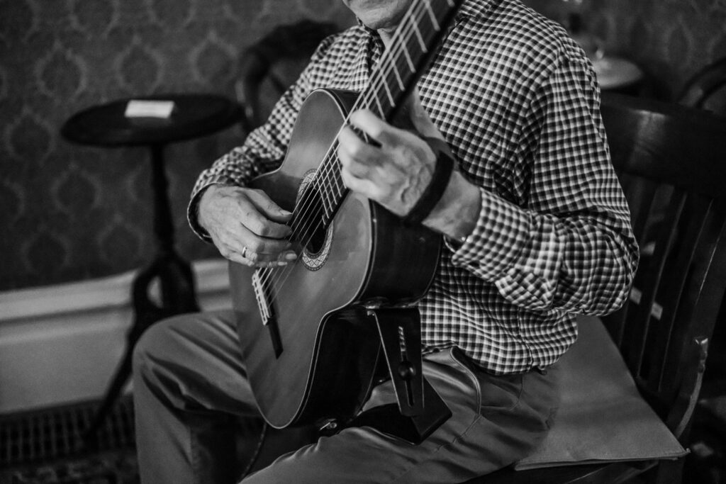 Guitarist playing music during the wedding ceremony at the John Muir historic house