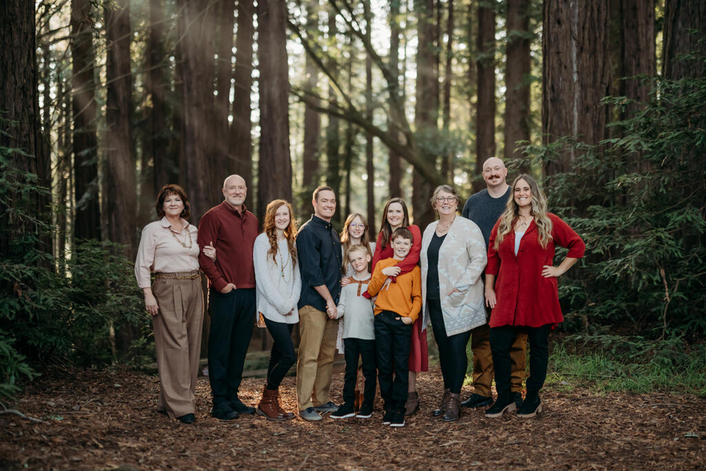 large extended family photography session with 2 sets of grandparents, cousins and aunts and uncles