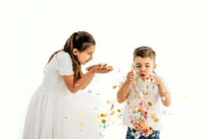 kids blow confetti