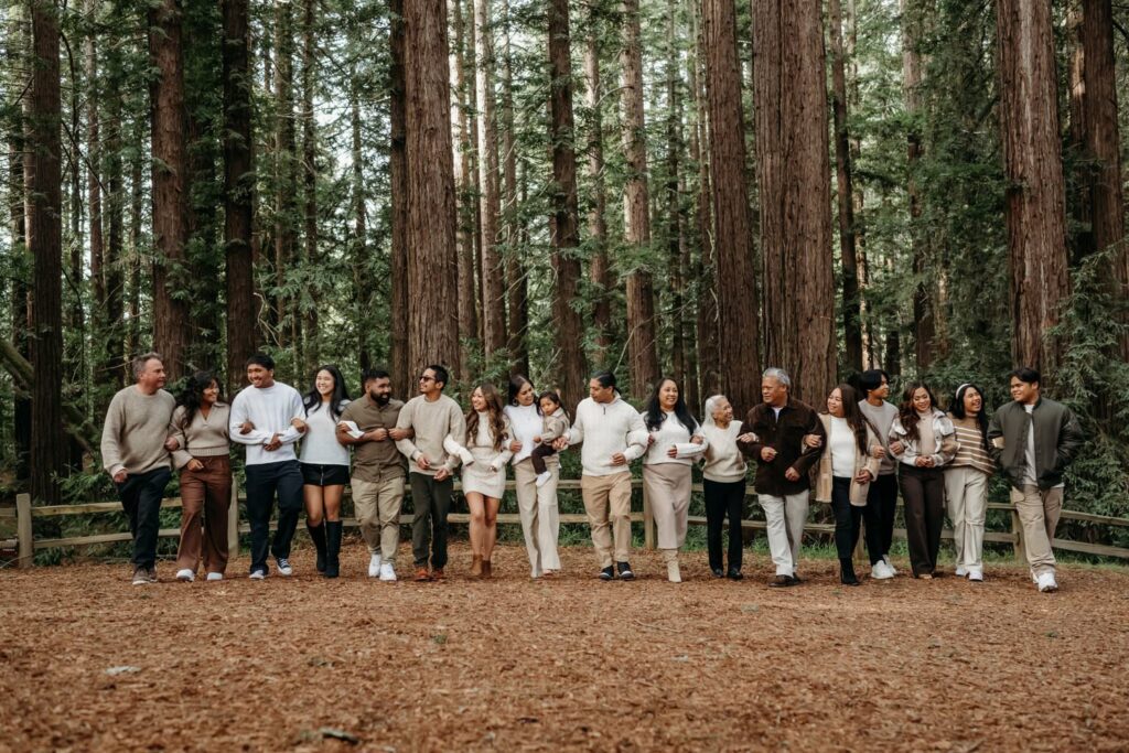 extended family including grandparents, cousins, aunts, uncles, in redwood forest
