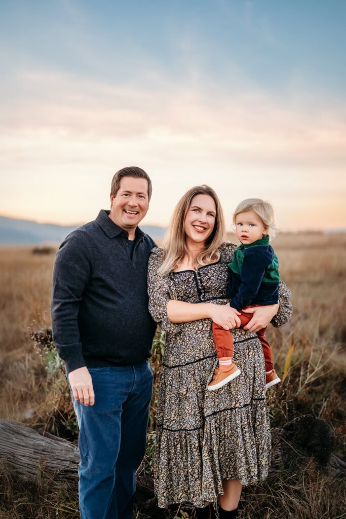beautiful sunset behind a family of 3 at  the martinez waterfront
