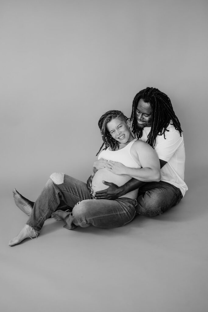 black and white minimalistic photoshoot with a pregnant mama and her husband